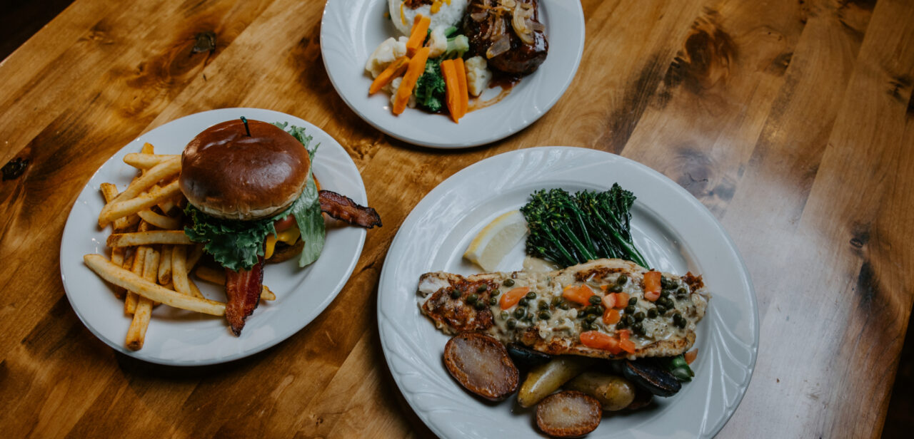 Three plates of beautifully plated dishes