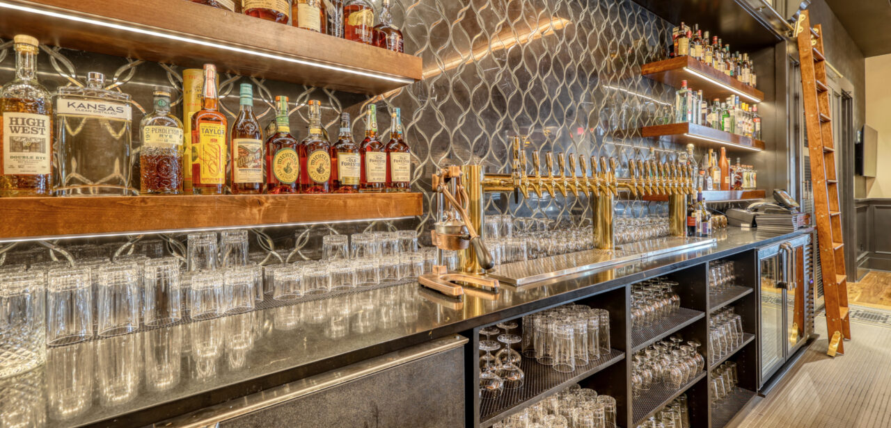 An Image of the bar and liquor offerings at Preacher Smith's Taproom & Commons