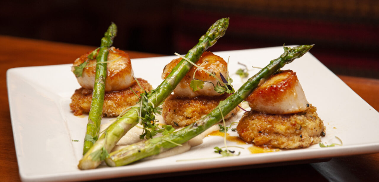 Seared scallops and crabcakes with asparagus