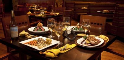 Deadwood grille restaurant with four meals setup on a table
