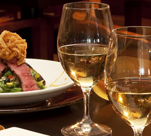Steak Dinner with glasses of wine