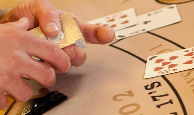 Man dealing a poker hand